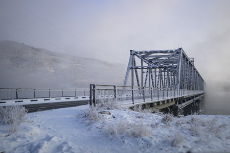bridge over a river in the winterの写真素材
