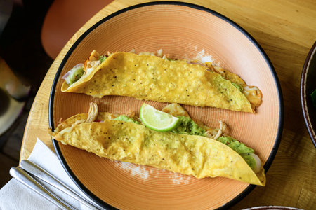 Mexican quesadilla with guacamole and limeの写真素材