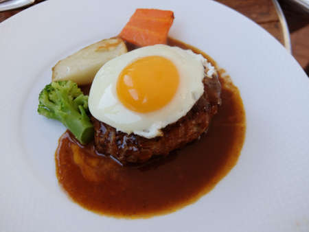 Hamburger steak with fried eggの写真素材