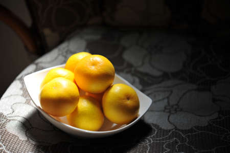 Mandarin oranges on a white plate