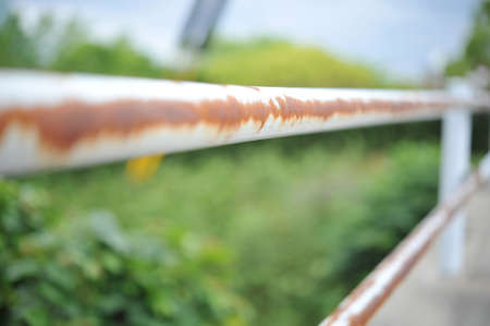 Rusted guardrail on sidewalk