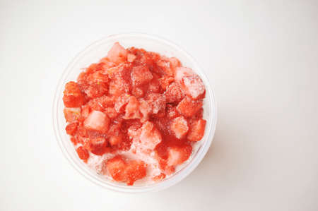 Ice cream filled with frozen strawberriesの写真素材