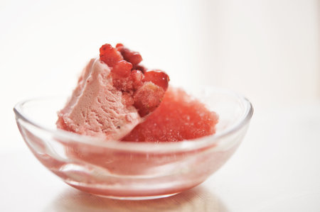 Ice cream filled with frozen strawberriesの写真素材