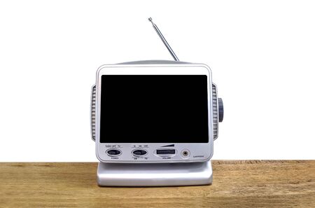 Mini analog television on wood table, isolate backgroundの写真素材