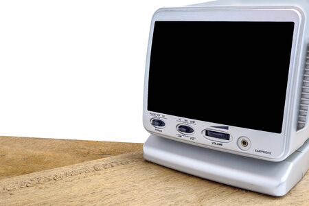 Mini analog television on wood table, isolate backgroundの写真素材