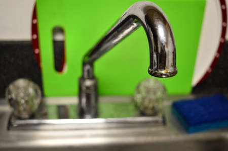 Closeup of a kitchen sink faucet