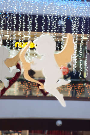 Angel in flight against blurred backgroundの写真素材