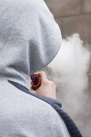 The man released the steam from vapeの写真素材