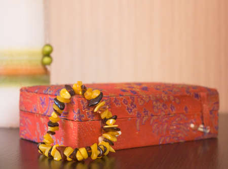 Women's jewelry bracelet with amber on the red boxの写真素材