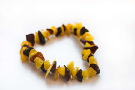 Women's jewelry bracelet made of amber on a white backgroundの写真素材
