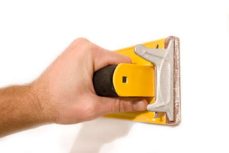 Treatment of walls in hand with sandpaper the finish stageの写真素材