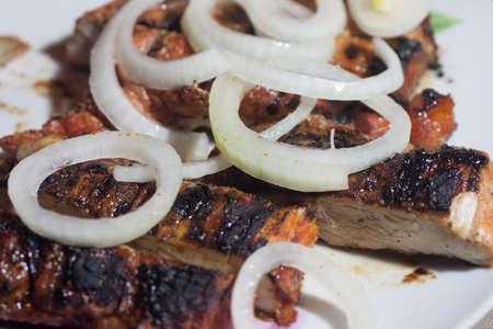 Steaks oJuicy and delicious Steaks on the grill with onionsの写真素材