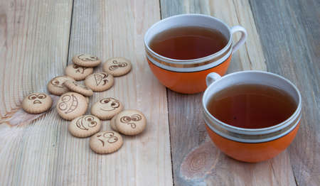 Cool cookies with smiles and tea. a little blurの写真素材