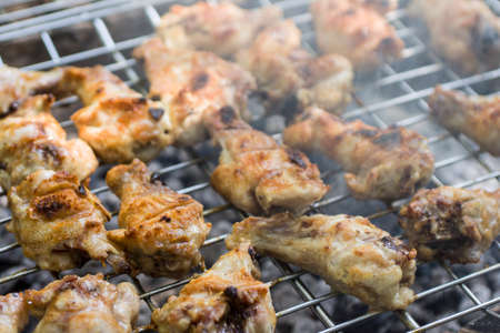 Barbecue chicken in the open air with smoke