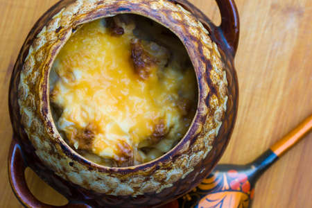 Casserole pots. The pots on the table.Pots standing on a Board with baked products inside.