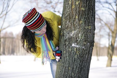 teen girl with snowball, surprised の写真素材