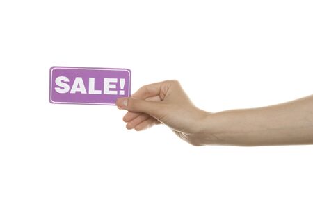 Sale with the text New in a woman's handの写真素材