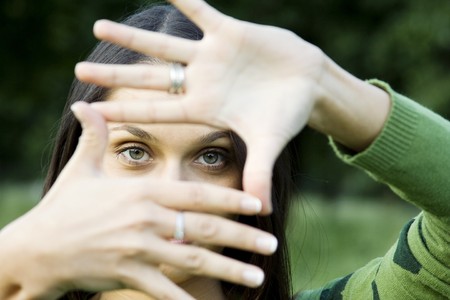 Woman making frame with her handsの写真素材