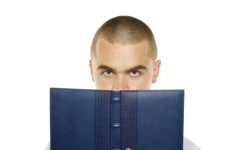 Portrait of a young man holding a blue notebook