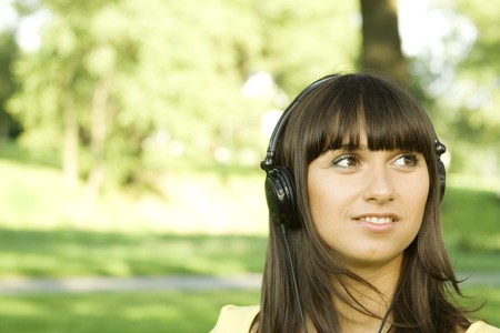 Young woman listening to music の写真素材