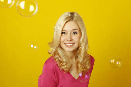 Girl enjoys soap bubblesの写真素材