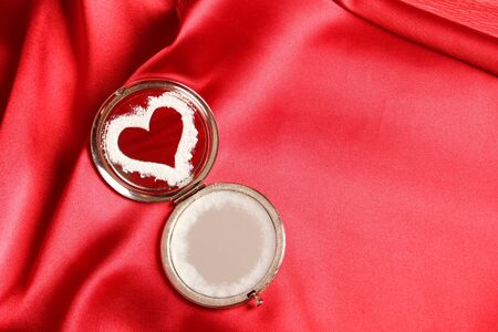 Frosty heart painted mirror  The mirror is on a red silk