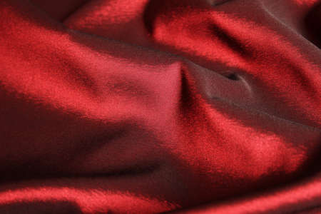 Close up of red satin fabric  backgroundの写真素材