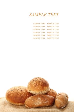 A lot of different breads are on sackcloth  isolateの写真素材