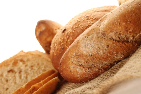 A lot of different breads are on sackcloth  isolateの写真素材