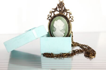 Close-up of vintage pendant in gift boxの写真素材