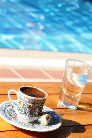 Traditional Turkish coffee is hot around the pool.の写真素材
