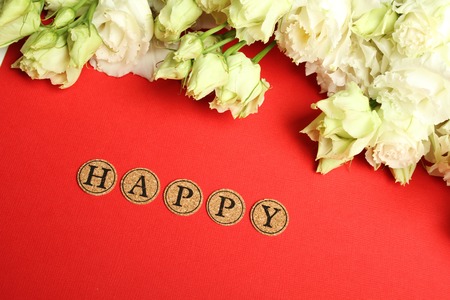 A postcard with a declaration of Happy. Roses and Letters with Happy Textの写真素材