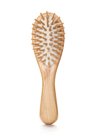 Close-up of a wooden hair brush. isolatedの写真素材