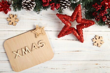 Christmas white background with new year attributes. Star, spruce, cones, text xmasの写真素材