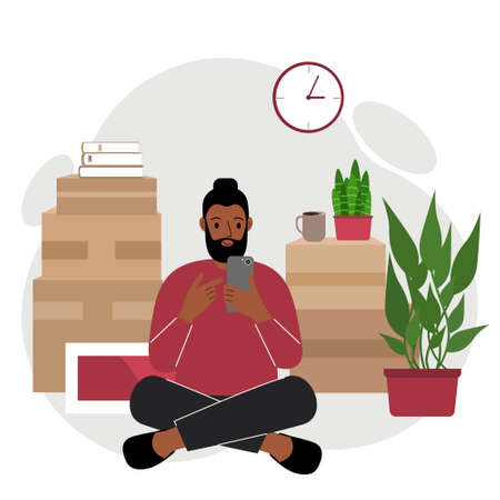 A man sits cross-legged with a mobile phone, orders delivery, there are many things around in cardboard boxes. The man is preparing to move to another home. Vector flat illustration.のイラスト素材