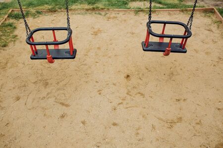 Childrens swing at the playground. Hight quality photoの写真素材