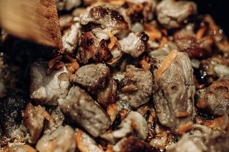 Pieces of meat are fried in oil.Home Cooking. Top View. Selective focusの写真素材