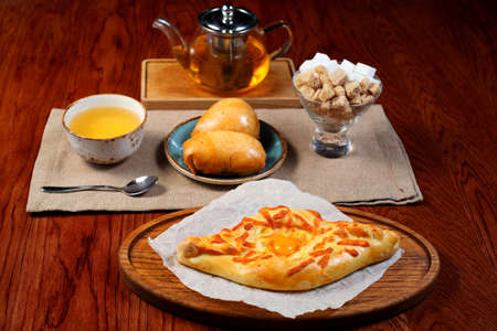 Tart with cheese, tea and samosa