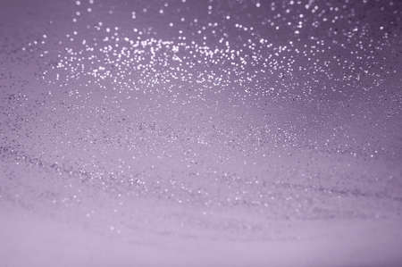 purple backgdrop with silver sequins and bokeh from sequins. festive texture in grape compote colorの写真素材