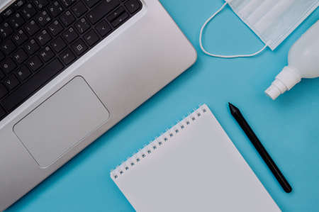 Layout flat lay on the theme of world quarantine by covid-19 and work at home. Notepad, graphic...