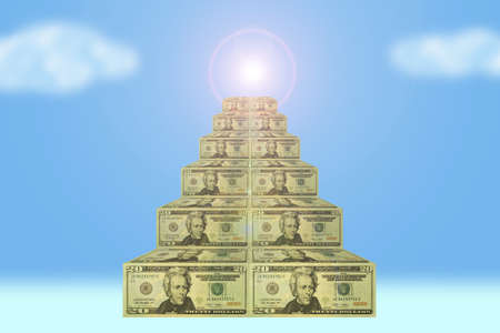 Ladder conducting upwards from money against the skyの写真素材