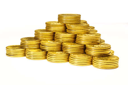 Pyramid from coins of yellow metal on a white backgroundの写真素材