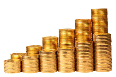 Coins from yellow and white metal on a white backgroundの写真素材