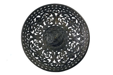 Ancient black metal dish on a white background