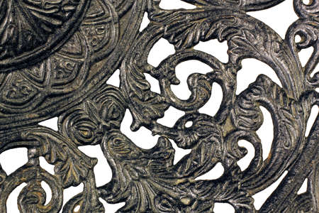 Fragment of a pattern of an ancient black metal plateの写真素材