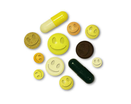 Multi-colored tablets with smiles on a white backgroundの写真素材