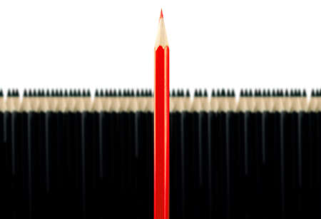 Red pencil among black pencils on a white backgroundの写真素材