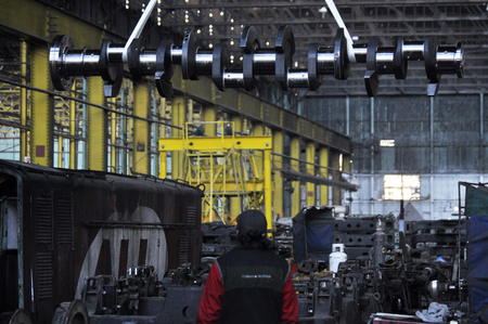 MENDOZA, ARGENTINE, June 11, 2013. Train maintenance, locomotive repair shop, in the image man working with machines, Central Park of Mendoza City, MENDOZA. Foto: Axel Lloret /のeditorial素材