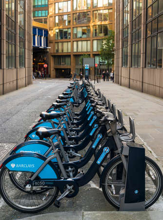 Long row of bikes for hire in the City of London.のeditorial素材