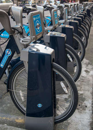 Long row of bikes for hire in the City of London.